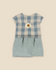 The Maileg Teddy Bedroom Set (ships in one week) features a small dress with a blue and white checkered top, fabric daisy, and light blue skirt—perfect for Maileg Teddy Mum, shown on a beige background.