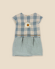 A cute Maileg Extra Clothing: Dress for Teddy Mum with a blue and white checkered top featuring a small white flower decoration, and a solid light blue lower section. The dress has short sleeves and is displayed on a plain beige background—the perfect outfit that can be paired with accessories you can purchase separately.