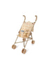 The Konges Sloejd Doll Stroller - Fleur Decor is a delightful beige and brown stroller with a removable floral-patterned fabric seat. It features four sets of double wheels and curved handles, making it ideal for imaginative play or as a charming decorative piece.