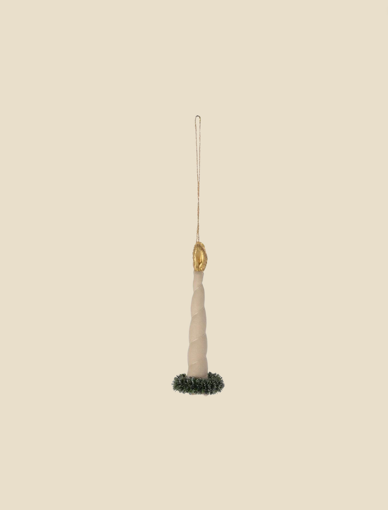 The Maileg Ornament - Candle Light features a unicorn horn-shaped pendant with a twisted design and a gold loop at the top for hanging, reminiscent of exclusive Christmas tree ornaments, set against a plain beige background.