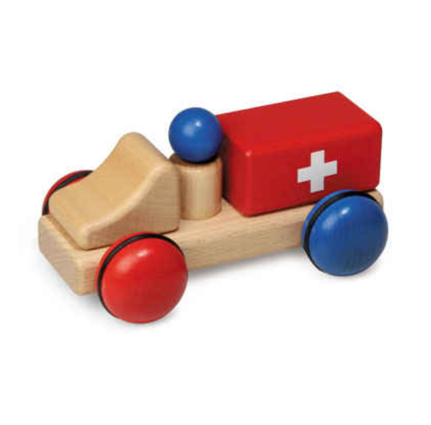 A Fagus Wooden Ambulance - Mini Series with red and blue elements and a white cross on the side, set against a white background.
