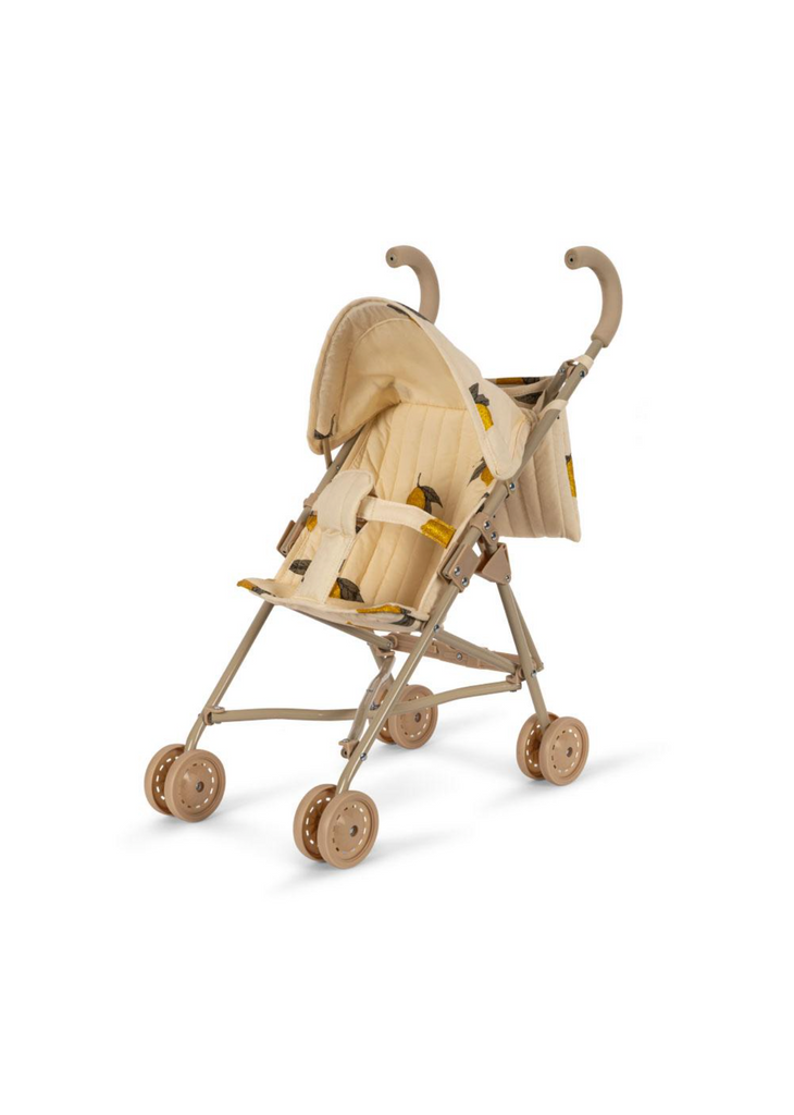 The Konges Sloejd Zoe Doll Stroller - Lemon features a cushioned seat and a foldable shade with a subtle lemon pattern. This stroller, reminiscent of a high-quality baby stroller, includes four sets of double wheels, a sturdy frame, ergonomic handles, and removable fabric. It is lightweight and foldable for easy maneuvering and child comfort.