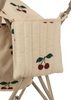 Close-up of a beige fabric with embroidered cherry designs in red and green, attached to a metal frame, suggesting it might be part of a Konges Sloejd Zoe Doll Stroller - Cherry. The cushioned seat features double wheels and a foldable shade for added convenience.