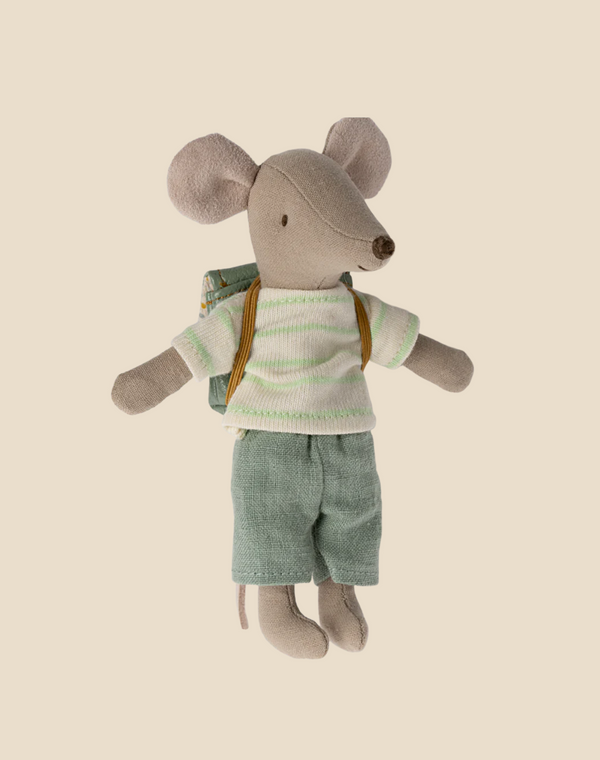 A Maileg Big Brother With Backpack - Mint dressed in a green-and-white striped shirt, teal shorts, and a green school backpack stands on a plain beige background. The mouse has a pink tail and large, round ears.