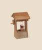 The Ostheimer Well with Roof is a small, hand-carved wooden well featuring a pitched roof and a simple crank handle. A tiny wooden bucket, suspended by a red string, hangs from the central beam. Handcrafted using sustainable materials, this charming piece is perfect for imaginative play and stands on a plain, neutral background.