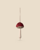 The Maileg Mushroom Ornament, featuring a soft fabric design with a red cap and white stem, is part of the enchanting Maileg ornaments collection. It hangs elegantly on a beige background, making it perfect for adding whimsical details to your Christmas tree.