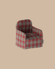 The Maileg Chair, Mouse - Red Checker features a charming plaid linen design with red checks on a beige background, adding a cozy touch reminiscent of a chair setting in a Gingerbread House.