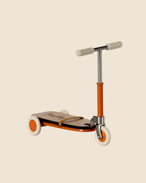 The Maileg Mouse Size Scooter in vintage-style orange and silver features wooden details, a sturdy metal stick, a wooden deck, and cream-colored wheels, all showcased against a plain beige background. Ships in approximately one week.