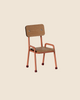 The Maileg Mouse Size School Chair - Coral features a charming wooden design with a simple backrest and seat supported by metal legs in a copper finish, complemented by red rubber-tipped feet. It's part of an enchanting chair set perfect for whimsical decor (ships in approximately one week).