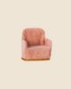 The PRE-ORDER: Maileg Soft Chair - Rose, featuring soft plush pink fabric and golden trim, sits invitingly against a beige background, creating the ideal spot for Maileg friends in your Mouse hole Farmhouse. (Ships late February).