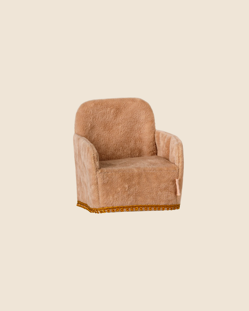 The Maileg Soft Chair in Powder, a cozy plush armchair with gold trim, is perfect for welcoming your Maileg friends into the Mouse Hole Farmhouse. Available for pre-order and ships late February.