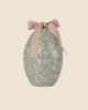 The PRE-ORDER Maileg Easter Egg - Mint (Ships in February) boasts a floral pattern in white on a light teal background, elegantly topped with a beige ribbon.