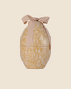 The PRE-ORDER Maileg Easter Egg in cream yellow is a metal container with a floral pattern and a pink bow, shipping in February.