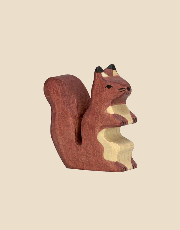 The Squirrel, brown is a handcrafted figurine made from maple and beech wood with painted brown and cream details, black eyes, and a bushy tail in the HOLZTIGER style, displayed on a plain beige background.