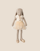 The Maileg Bunny, Size 3 - Classic, wears a cream ballet suit and skirt with matching accessories, standing upright against a beige background ready to dance.