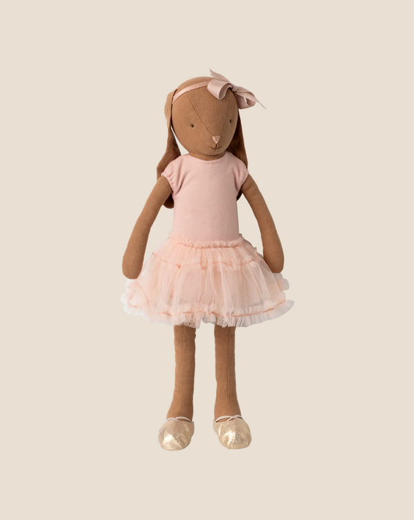 A Maileg Bunny, Size 3, in chocolate brown, wearing a ballet suit and rose skirt, is set against a plain beige background.