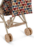 A close-up of the Konges Sloejd Doll Stroller - Heart Kisses, featuring tan double wheels, a sturdy frame, and a fabric canopy adorned with rows of blue, red, and tan hearts.