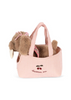 The Konges Sloejd Maude Puppy in Basket is a soft toy with a pink bow, nestled in a pink gingham tote embroidered with cherries and “cherrie me.”.