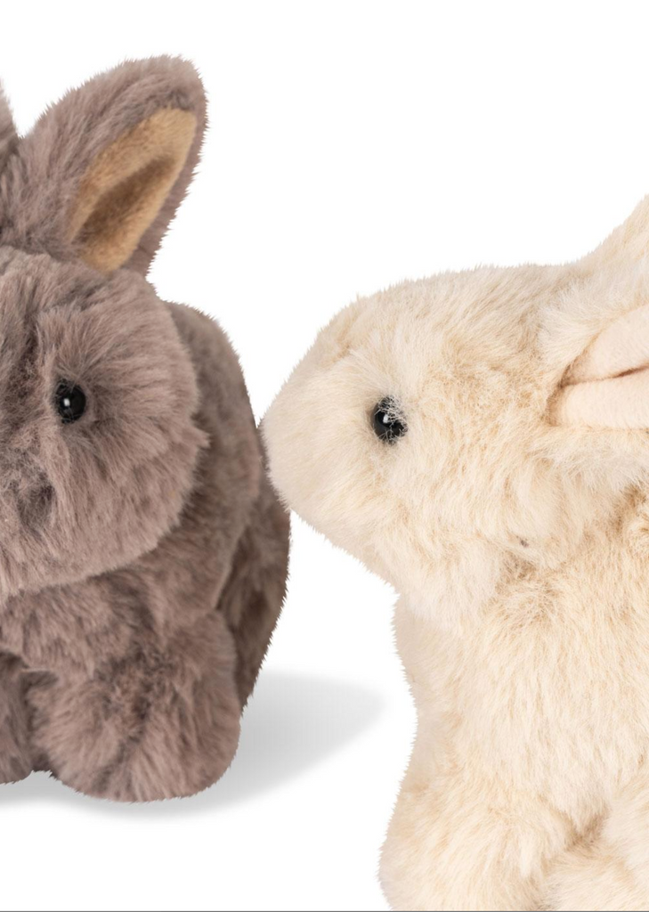 The Konges Sloejd Bunnys in Basket Set features two plush toy rabbits, one gray and one cream-colored, facing each other like soft little bunnies against a white background.