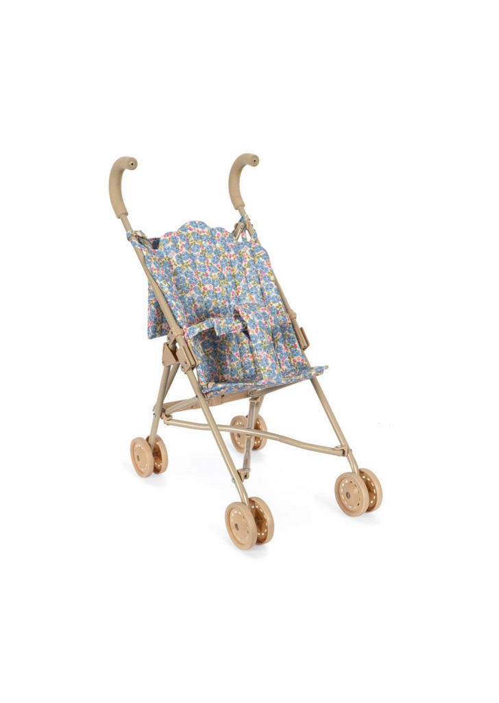 The Konges Sloejd Doll Stroller - Rose Flower has a beige frame with curved handles, double wheels at each corner, and a seat covered in colorful floral fabric. It’s pictured empty against a plain white background.
