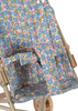 The Konges Sloejd Doll Stroller - Rose Flower features a beige frame, double wheels, and a removable fabric seat with a blue, pink, and green floral pattern. The stroller also includes a visible footrest and safety bar.
