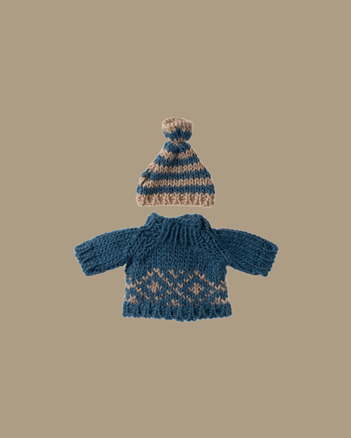 A Maileg Extra Clothing set for Dad Mouse: a small, hand-knitted blue sweater and matching hat with beige accents in a Scandinavian pattern, shown on a plain beige background.