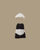 The Maileg Extra Clothing: Maid Clothes for Big Sister Mouse features a petite black dress with apron and matching white bonnet, both laid flat on a beige background—classic maid attire in miniature for your mouse.