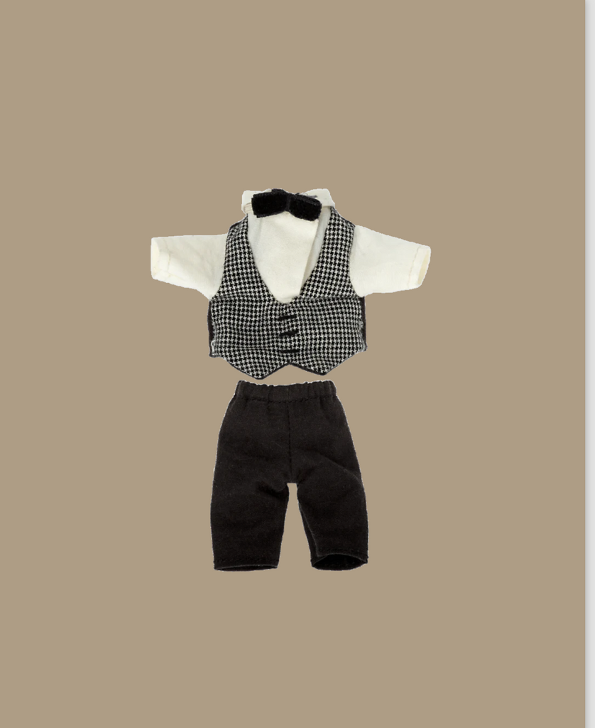 The Maileg Extra Clothing: Waiter Clothes set for Big Brother Mouse includes a white shirt with black bow tie, black and white checkered vest, and black pants, all displayed on a beige background.