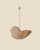 The Maileg Fabric Ornament, Bird - Mable - Latte features soft fabric, stitched details, and patterned wings, hanging from a string with a button—an adorable decoration for your Christmas tree.