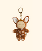 The Olli Ella Cozy Bag Charm - Fawny Lala features a small plush doll in a brown and white spotted deer costume with closed eyes and large ears, attached to a gold keyring.