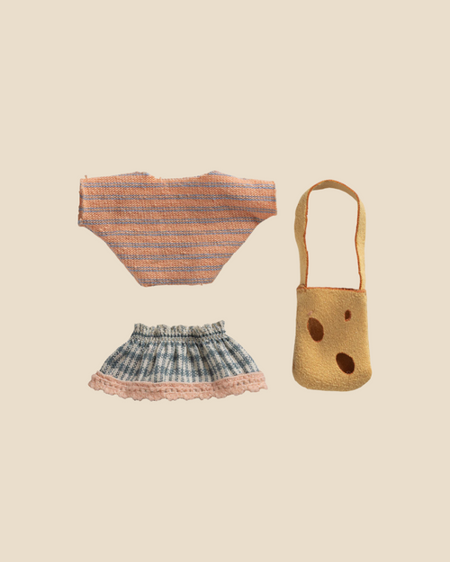 A flat lay of Maileg Clothes and Bag for Little Sister Mouse (Pre-order, expected 06/15/26): includes a striped knit top, blue plaid skirt with pink lace hem, and cut-out yellow felt bag—all shown on a beige background.
