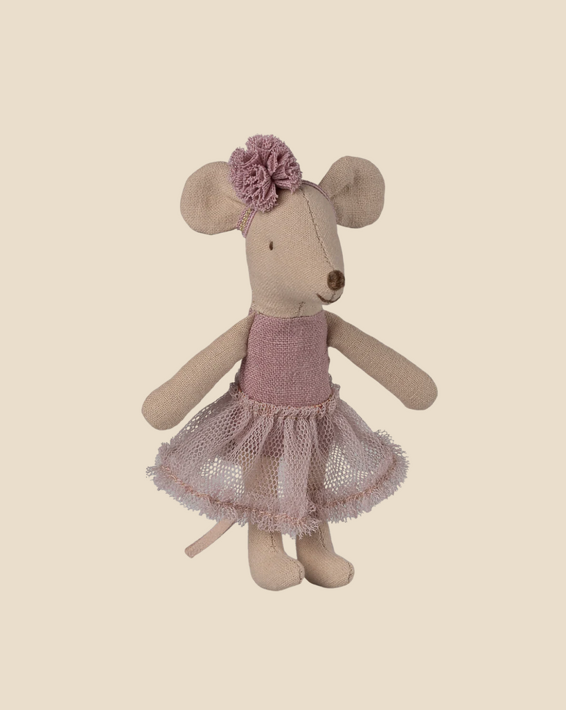 The Pre-order: Maileg Ballerina Mouse, Little Sister - Heather wears a dusty pink dress with a mesh skirt and a matching pink flower headband, standing upright against a plain cream background.