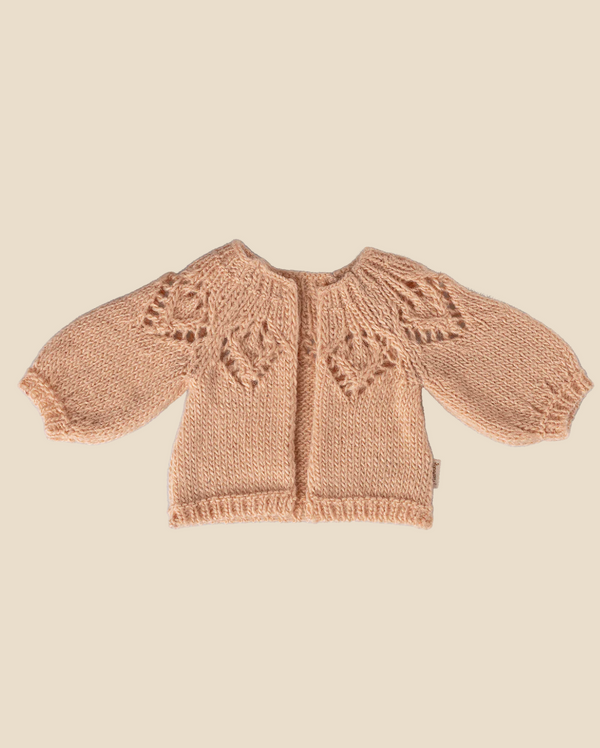Pre-order the Maileg Knitted Cardigan for Bunny Size 3 in Light Rose—featuring heart patterns, wide sleeves, and a round neckline. Perfect bunny clothes; laid flat on a neutral background. Expected arrival: 02/15/26.