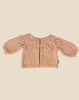 Pre-order the Maileg Knitted Cardigan for Bunny Size 4 in light rose, featuring long sleeves and a leaf yoke. Perfect as bunny clothes or an adorable rabbit sweater. Expected arrival by 02/15/26.