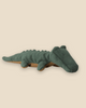 The Pre-order: Maileg Crocodile, Small - Forest Green features a soft, plush design with a dark green body and brown underside, offering a friendly, huggable look. Expected arrival by 06/15/26.