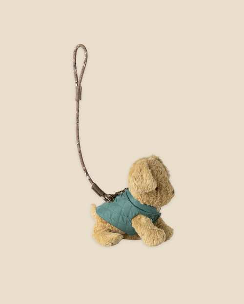 A plush toy dog models the Pre-order: Maileg Pet Supply, Harness and Leash - Dark Mint (Expected arrival by: 03/01/26), stylishly displayed on a plain light beige background.