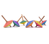The Mader Tukan Spinning Top - Red & Blue is an Austrian wooden toy with a red and blue layered striped design and a wooden handle, arranged upright on a white background.