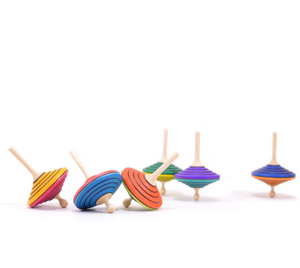The Mader Tukanino Spinning Top in orange is a vibrant maple wood fingertop inspired by classic Austrian designs, and part of a collection featuring distinct hues like blue, green, yellow, and purple.