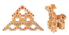 Two Bauspiel Colored Stair Blocks creations display colorful gem stickers: one forms a pyramid with cross-shaped holes, and the other, built from the 40-piece set, resembles an animal with four legs and a long neck.
