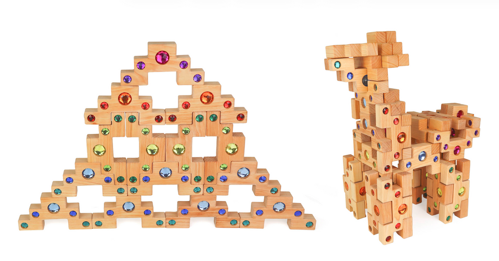 Two Bauspiel Colored Stair Blocks creations display colorful gem stickers: one forms a pyramid with cross-shaped holes, and the other, built from the 40-piece set, resembles an animal with four legs and a long neck.