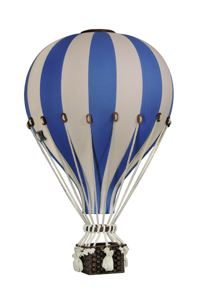 A handmade children's room decor piece, the Hot Air Balloon - Marine Blue features blue and white stripes, a small wicker basket, and white sandbags hanging below. Isolated on a white background, this charming decoration adds a whimsical touch to any nursery or playroom.
