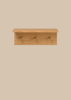 The Ferm Living Place Rack - Small is a simple oak wall rack with three round pegs for hanging items, ideal for home organization, shown mounted on a light beige background.