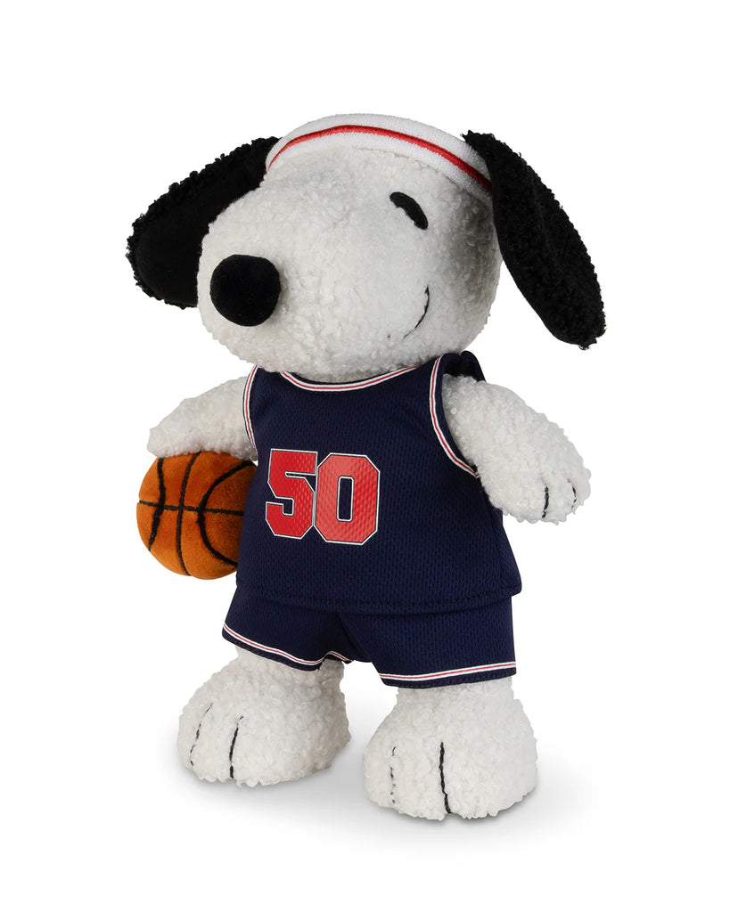 Peanuts Snoopy - Basketball by Bon Ton Toys features Snoopy in a navy basketball uniform with the number 50, holding a small basketball and standing upright against a white background.