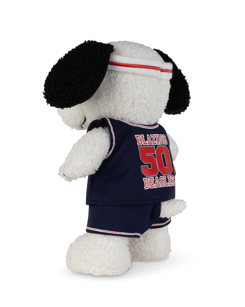 The Peanuts Snoopy - Basketball plush by Bon Ton Toys, inspired by Peanuts, features a navy basketball uniform and red-and-white headband with "BLAZING BEACLES 50" on the back of the jersey.