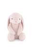 The Snuggle Bunnies - Penelope - Blossom is a soft, light pink plush bunny with long floppy ears, round black eyes, and a small nose, sitting upright against a plain white background.