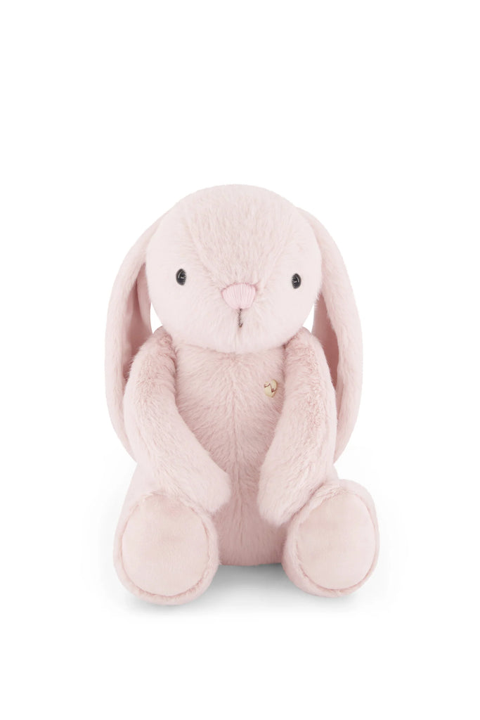 The Snuggle Bunnies - Penelope - Blossom is a soft, light pink plush bunny with long floppy ears, round black eyes, and a small nose, sitting upright against a plain white background.