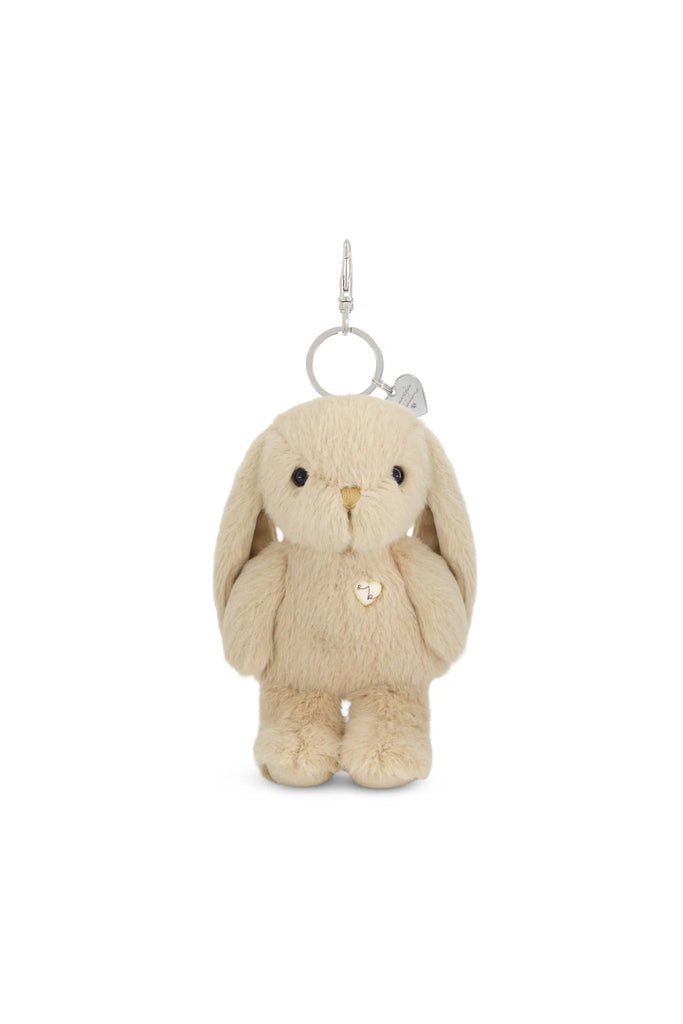 The Snuggle Bunnies - Penelope Keyring - Caramel is a beige soft bunny bag charm with floppy ears, black button eyes, a heart-shaped chest charm, and a silver keyring clasp—perfect for adding cuteness to any bag.