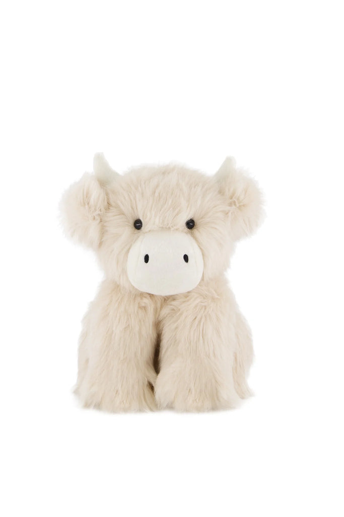 Snuggle Bunnies - Hilda The Highland Cow features long, fluffy cream fur, small horns, black eyes, and a soft snout—an adorable plush that sits upright and makes a perfect cuddle companion or thoughtful baby shower gift.