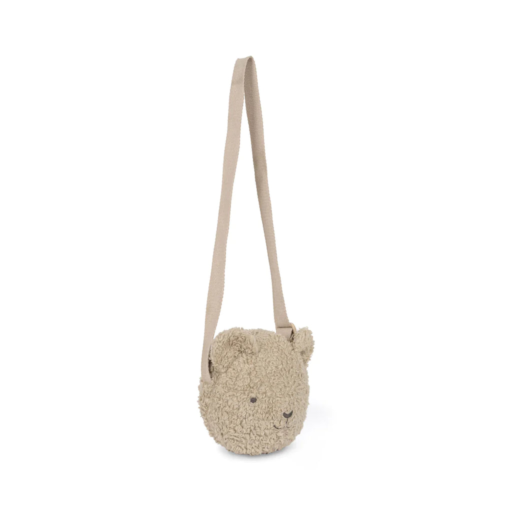 Child's plush Teddy Bear Shoulder Bag in organic sherpa, with a happy face and an adjustable shoulder strap, isolated on a white background.