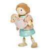 A Mrs. Goodwood and her Baby figurine, painted with soft colors. The mother wears a pink sweater and a teal skirt, while the baby is in a striped blanket.